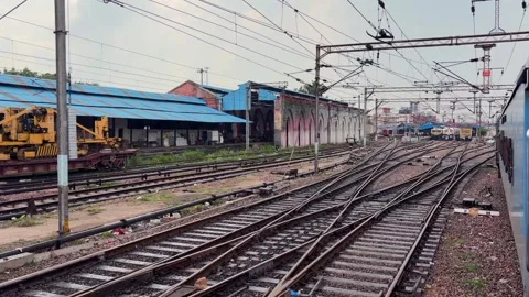 Shot of slow speed train running in Delhi, Train entering at railway station of Видео 347018890
