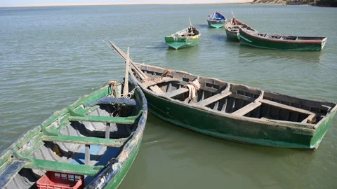 Shot of small boats that are docked near the port of Naila lagoon Stock Footage 245638577