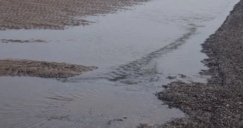 Shot of small river channels at low tide at Gronant beach Stock Footage 345359120