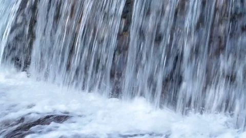 Shot of a small waterfall with crystal clear water. High definition video. Stock Footage 79439446
