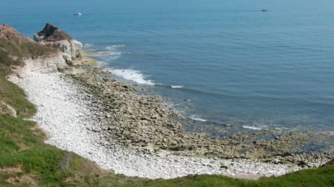 Shot of small waves crash on white chalk beach Stock Footage 199962145