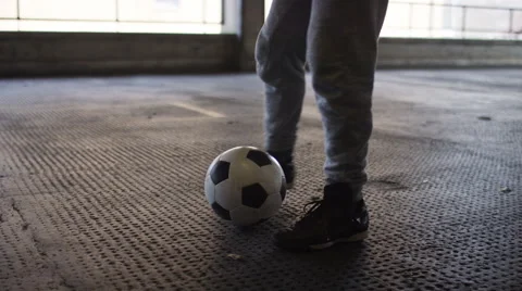 Shot of soccer freestyle player doing tricks with the football, in slow motion Stock Footage 61909286