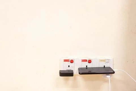 Shot of socket plug on the wall Stock Photos