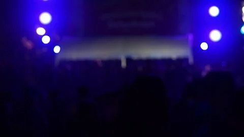Shot of some cheering fans dancing in a free live concert in music festival. Stock Footage 91902244