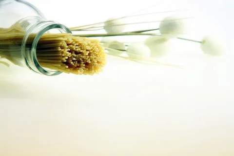 A shot of some spaghetti inserted into a bottle Stock Photos