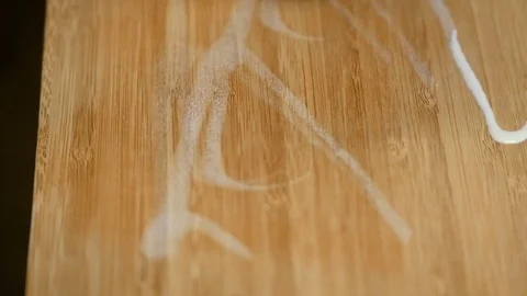 Shot of someone oiling a wodden plank in Norway, oil Stock Footage 85161387