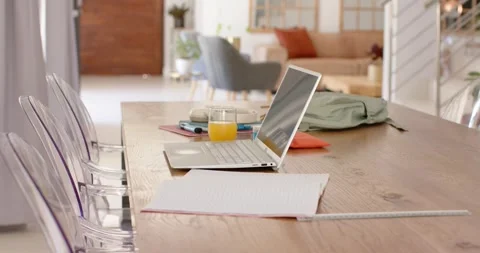 Shot starting, camera pulling and tightening on laptop, pad on table near door, Stock Footage 335199396