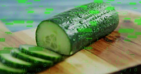 Shot starting green code glitching across cucumber, knife slicing slices Stock Footage 311050785