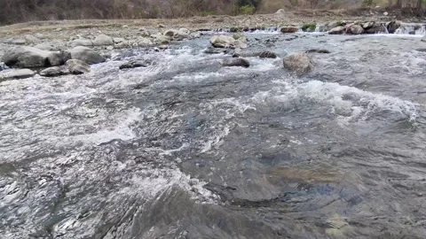 Shot of stream of water. Beautiful view of flowing river water Aswani Khad Stock Footage 302662666