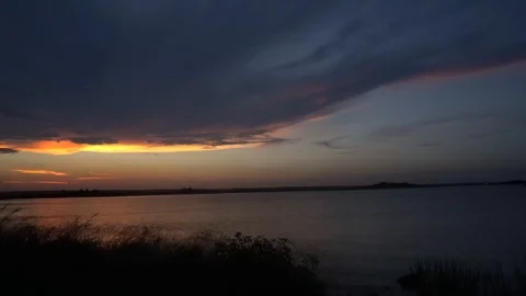 Shot of Sunset over Bay Stockbeeldmateriaal 98909552