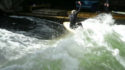 Shot of surfer surfing in Eisbach River in Munich Stock Footage 70817029
