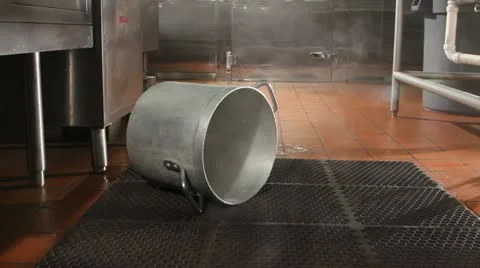 Shot of toppled pot on steaming kitchen floor Stock Footage 21624788