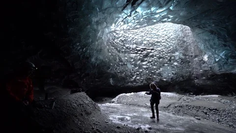 Shot of tourists walking inside the ice cave in Breidamerkurjokull, Iceland Stock Footage 120475967