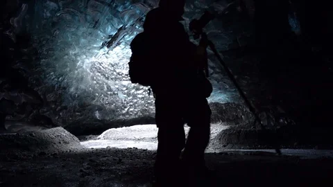 Shot of tourists walking inside the ice cave in Breidamerkurjokull, Iceland Stock Footage 120476038