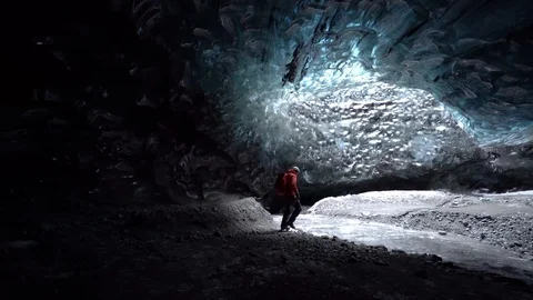 Shot of tourists walking inside the ice cave in Breidamerkurjokull, Iceland Stock Footage 120476090