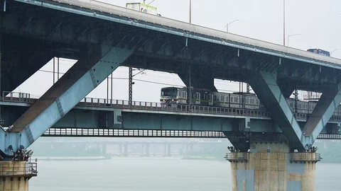 Shot of train moving through Cheongdam Bridge across Han River Stock Footage 123261615