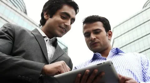 Shot of two smiling businessmen using a digital tablet Stock Footage 30078978