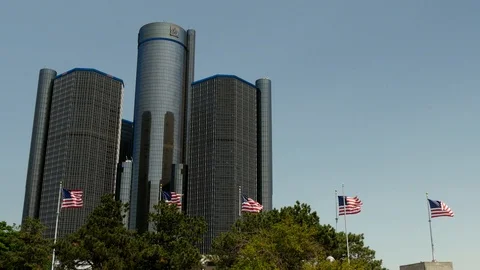 A shot of USA flags flying outside of the renaissance centre Detroit Stock Footage 87341195