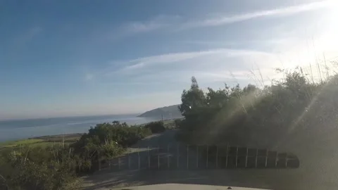 A shot from a vehicle of a mountain road facing the sea Video stock 149045853