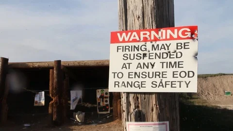 Shot up warning sign on shooting range Stock Footage 113908950