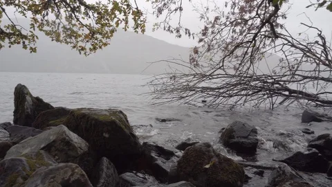 Shot at water level of the agitated waters of Loch Ness, Scotland. Stock Footage