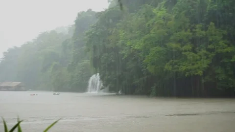 Shot of waterfall and river during heavy raining in Thailand Video stock 88738865