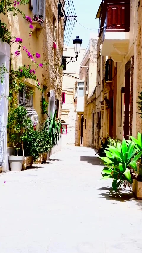 Shot while walking through narrow alley of Mdina Stock Footage 279000862