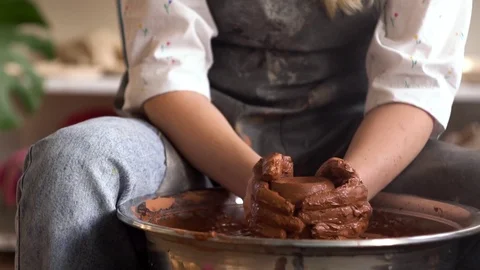 Shot of woman's hands worked on a pottery wheel Stock Footage 123499544