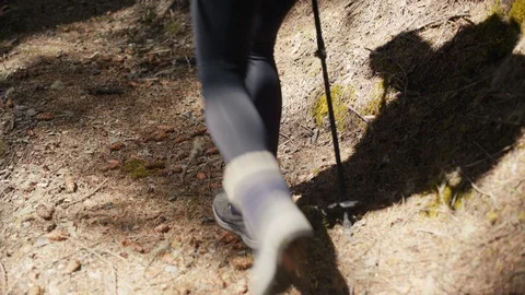 Shot of woman's shadow while hiking on trail Stock Footage 89817400