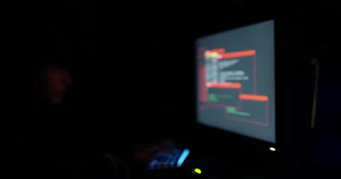 Shot of a young hacker cracking a computer code in the dark Stock Footage 151446442