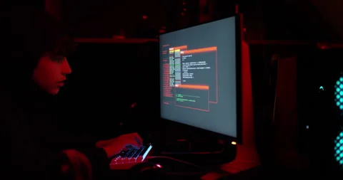 Shot of a young hacker cracking a computer code in the dark Stock Footage 151447254