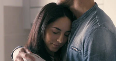 Shot of a young man is giving an effective hug and tender kiss to his fiance Vídeo Stock 141379360