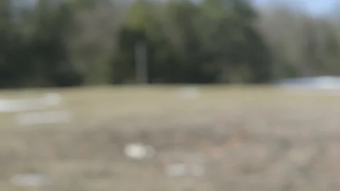 Shotgun 4k - Lifting up into frame in Slomo Stock Footage 120488265