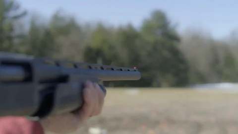 Shotgun 4k - Slow Motion Racking Spent Shell with Smoke Stock Footage 120488320