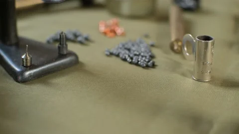 Shotgun cartridges reloading. capsules, shells, powder, cartridges, scales on th Stock Footage 197465195