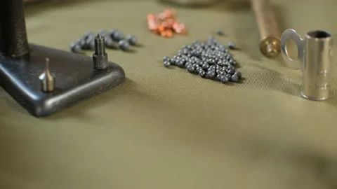 Shotgun cartridges reloading. capsules, shells, powder, cartridges, scales on th Stock Footage 197465540