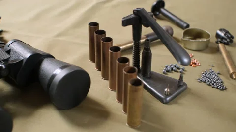 Shotgun cartridges reloading. capsules, shells, powder, cartridges, scales on th Stock Footage 197466044