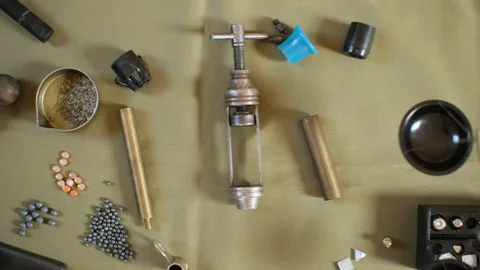 Shotgun cartridges reloading. capsules, shells, powder, cartridges, scales on th Stock Footage 197466474