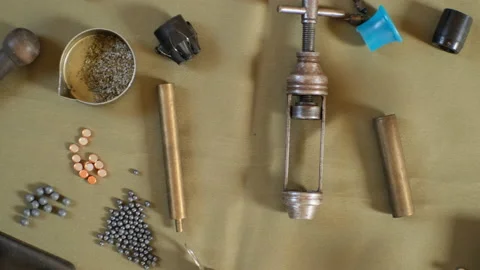 Shotgun cartridges reloading. capsules, shells, powder, cartridges, scales on th Stock Footage 197467210