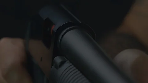 A shotgun shell is ejected from a shotgun. Close up shot. Stock Footage 104935497