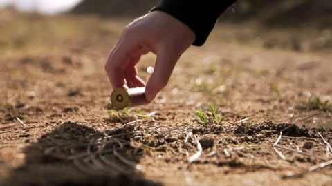 Shotgun Shell Impact and Pick up Stock Footage 128070342