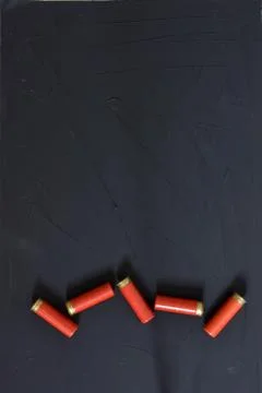 Shotgun shells isolated on background. Top view. Copy text place. Stock Photos