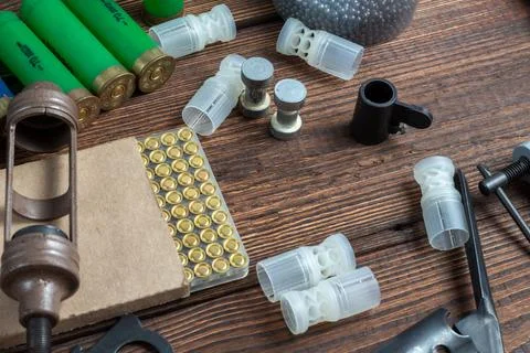 Shotgun shells reloading process with special reload equipment. Powder, bulle Stock Photos