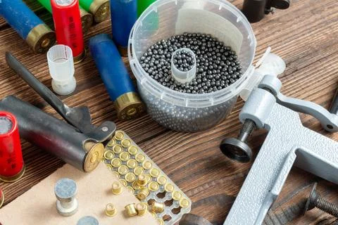 Shotgun shells reloading process with special reload equipment. Powder, bulle Stock Photos