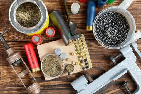 Shotgun shells reloading process with special reload equipment. Powder, bulle Stock Photos