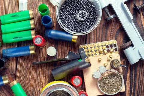 Shotgun shells reloading process with special reload equipment. Powder, bulle Stock Photos