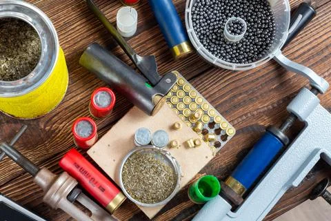 Shotgun shells reloading process with special reload equipment. Powder, bulle Stock Photos