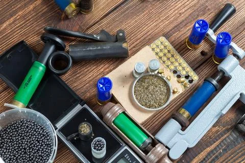 Shotgun shells reloading process with special reload equipment. Powder, bulle Stock Photos