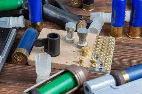 Shotgun shells reloading process with special reload equipment. Powder, bulle Stock Photos