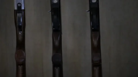 Shotguns on rack Stock Footage 23792403